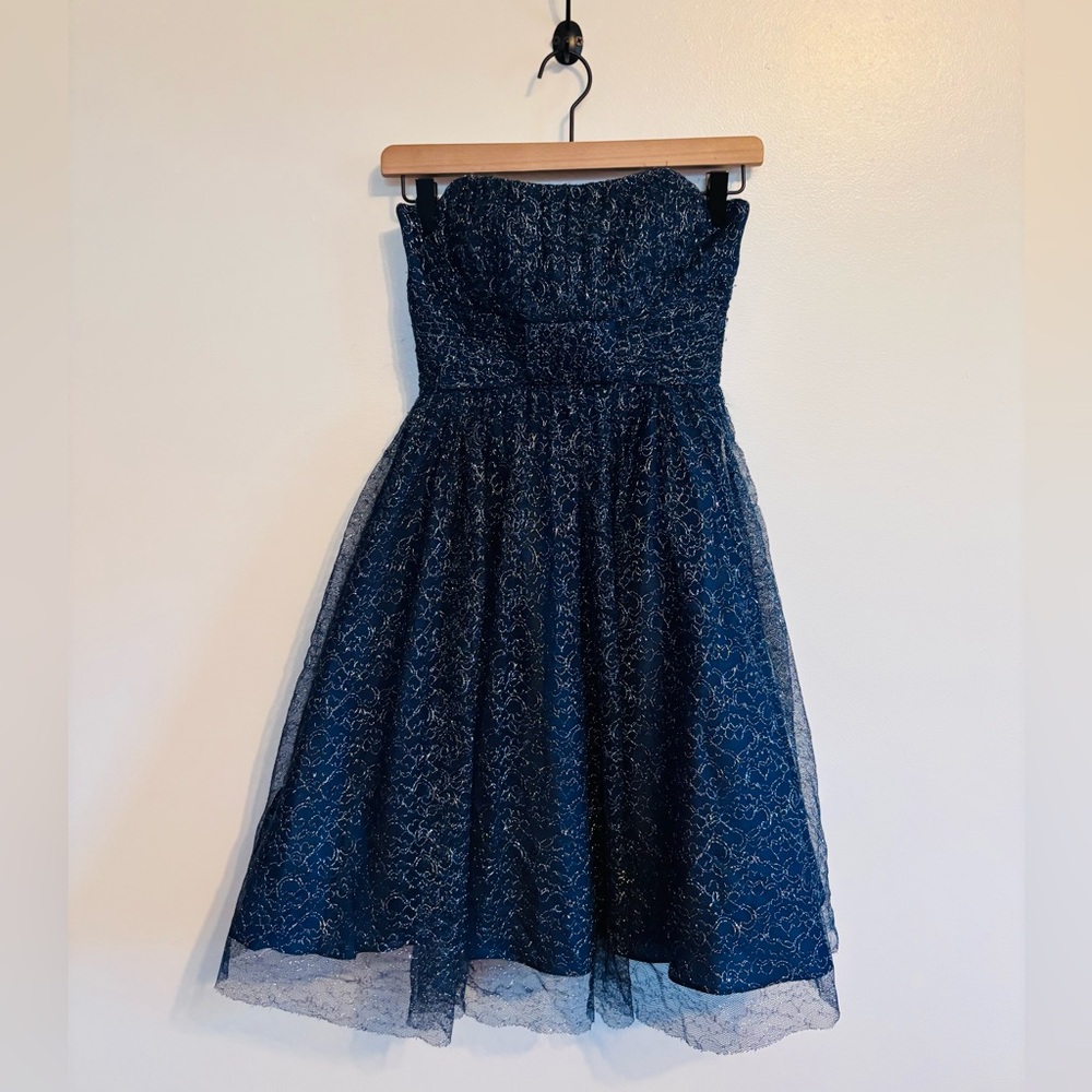 De Leary dark blue strapless formal lace dress.  Fitted bodice and flared